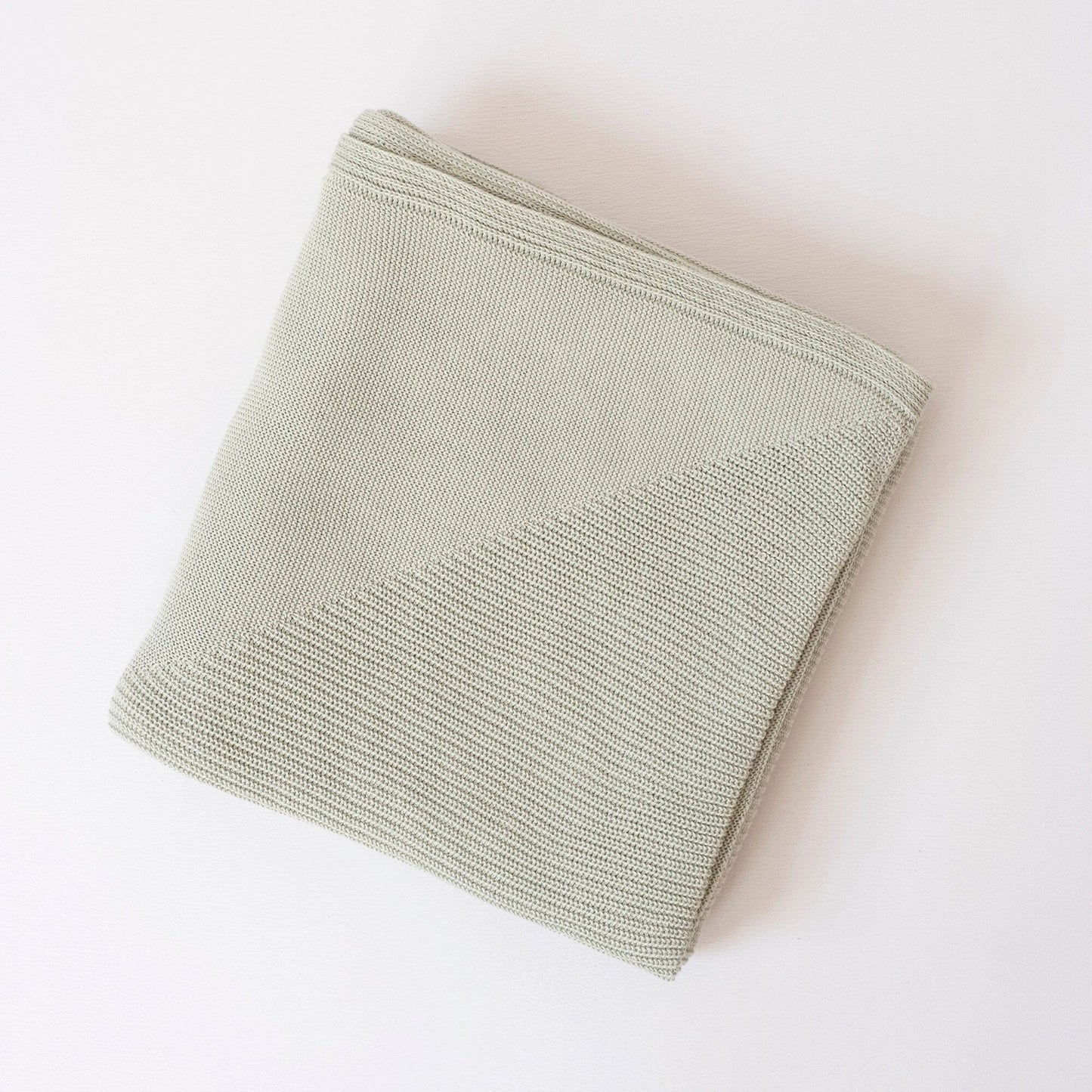 Folded Organic Cotton Throw in Lichen Color