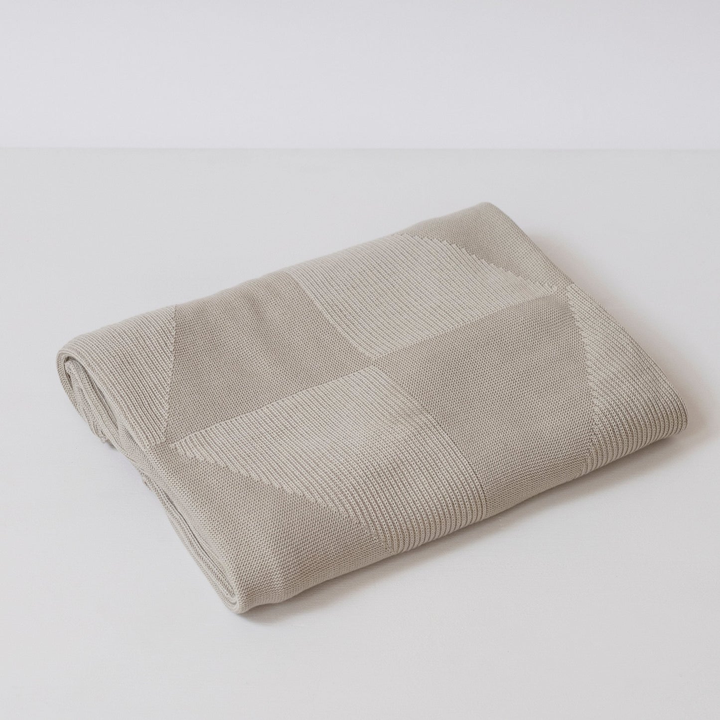 folded dove grey geo panel throw blanket