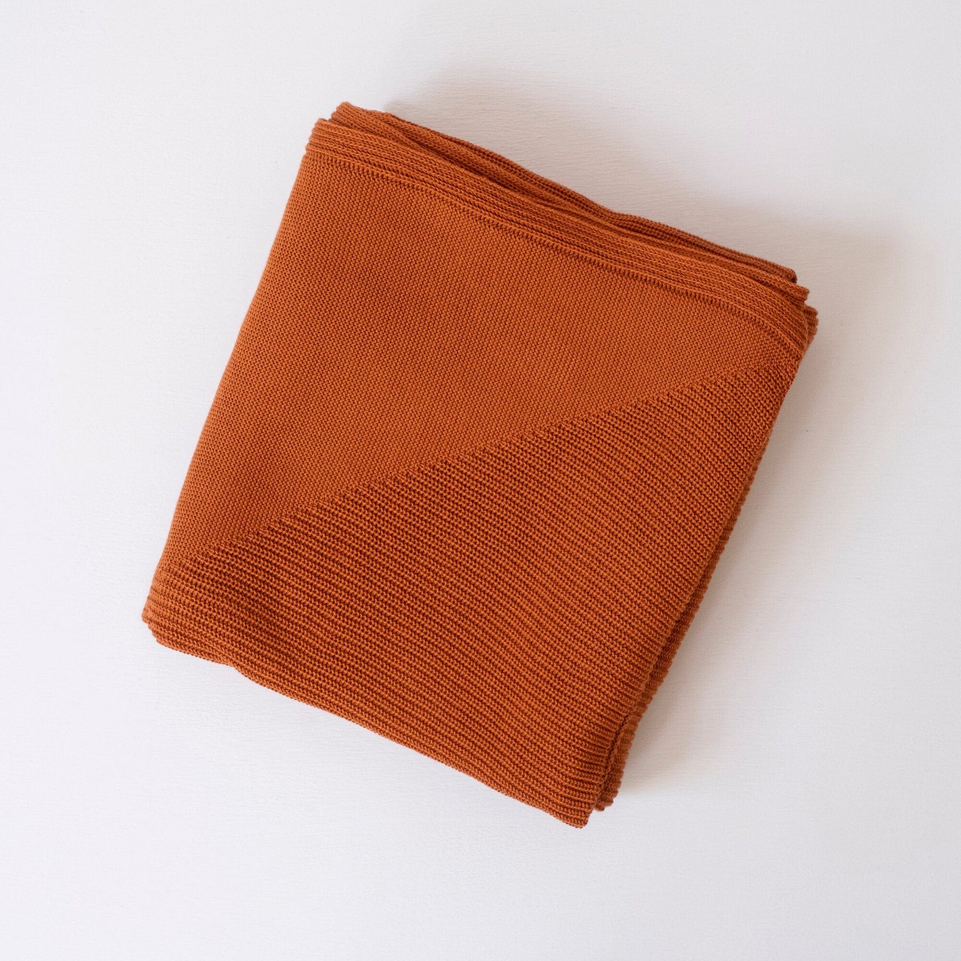 Folded Organic Cotton Throw in Terracotta Color