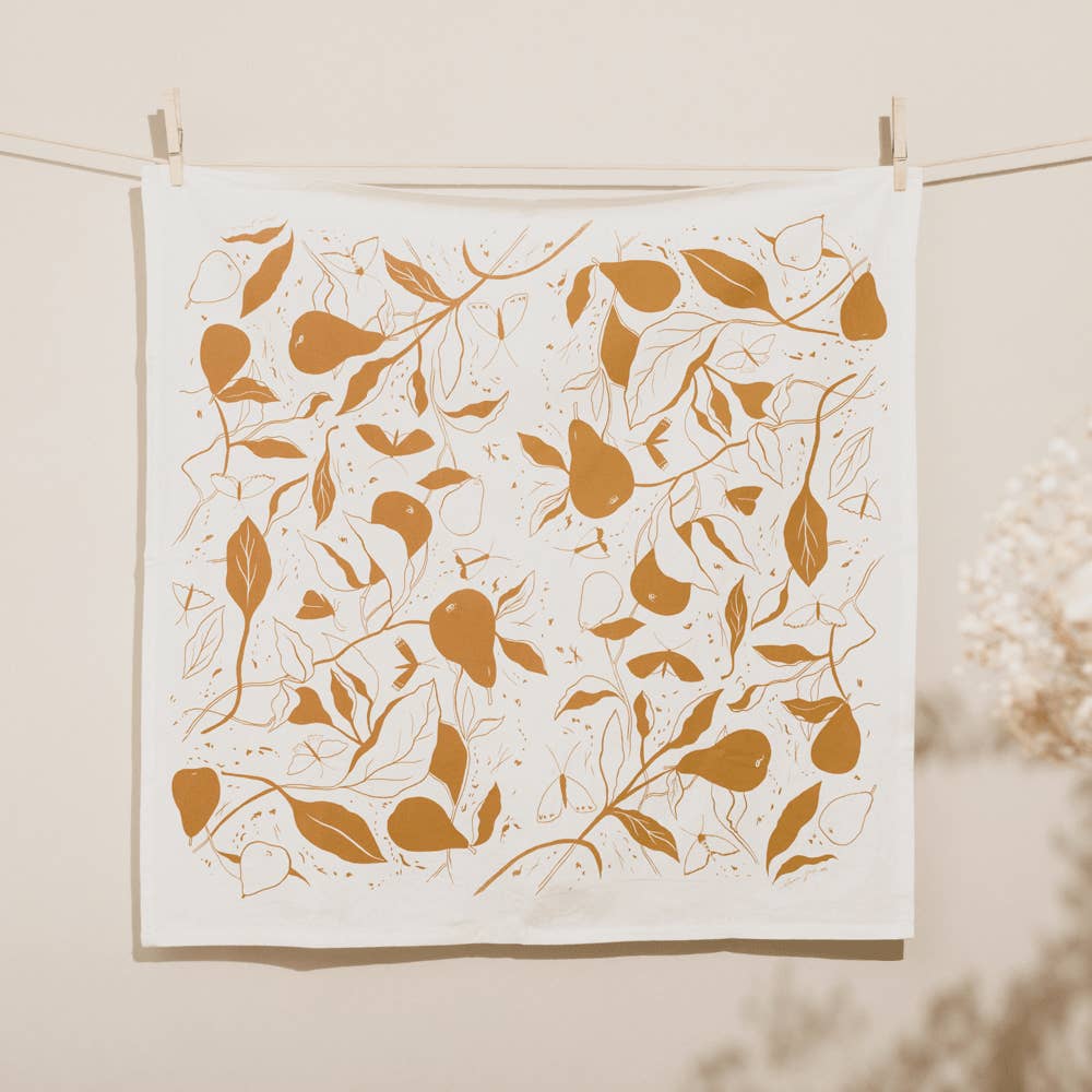 Pears tea towel made in the USA by Elana Gabrielle hanging on a wire