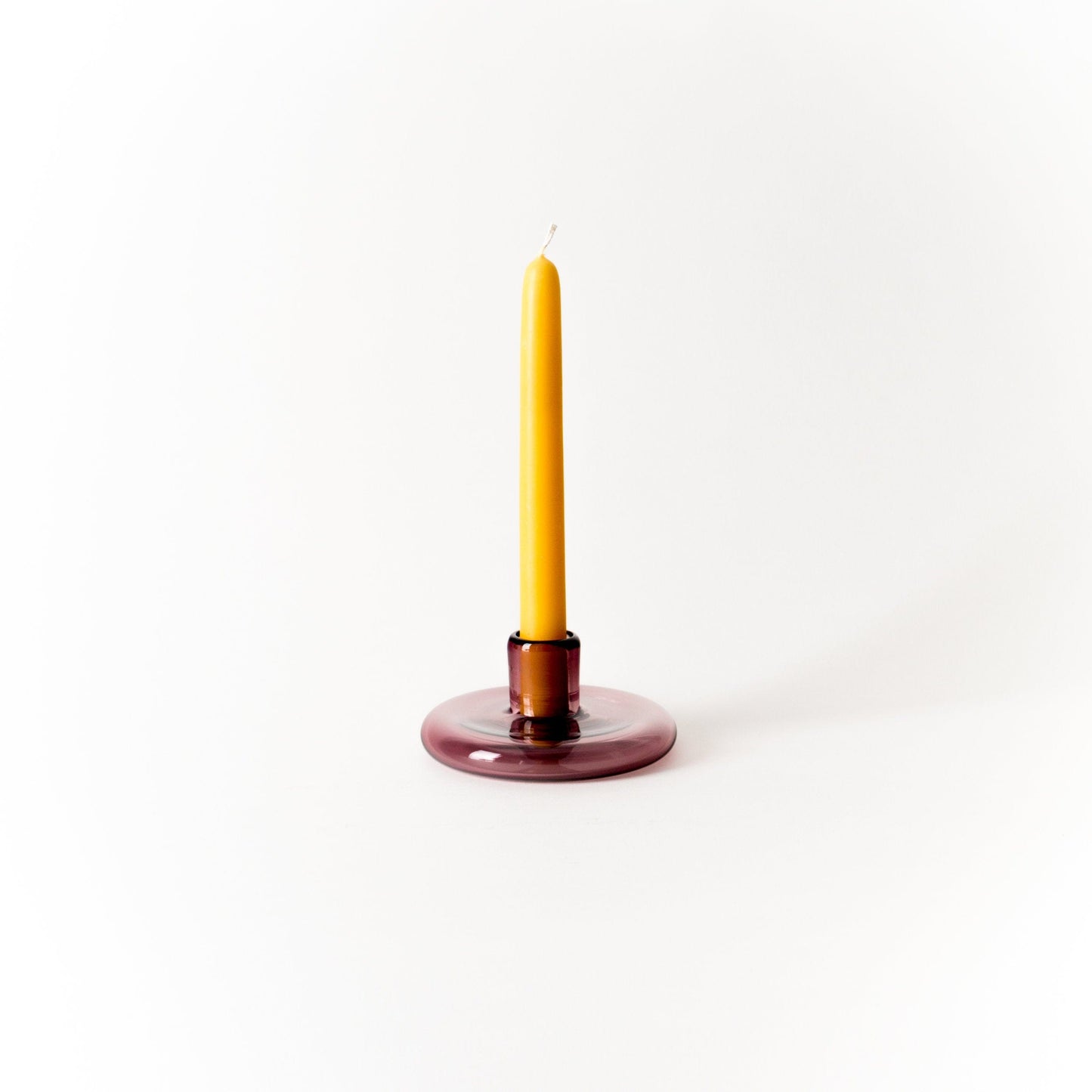 Rose colored handblown glass candlestick holder
