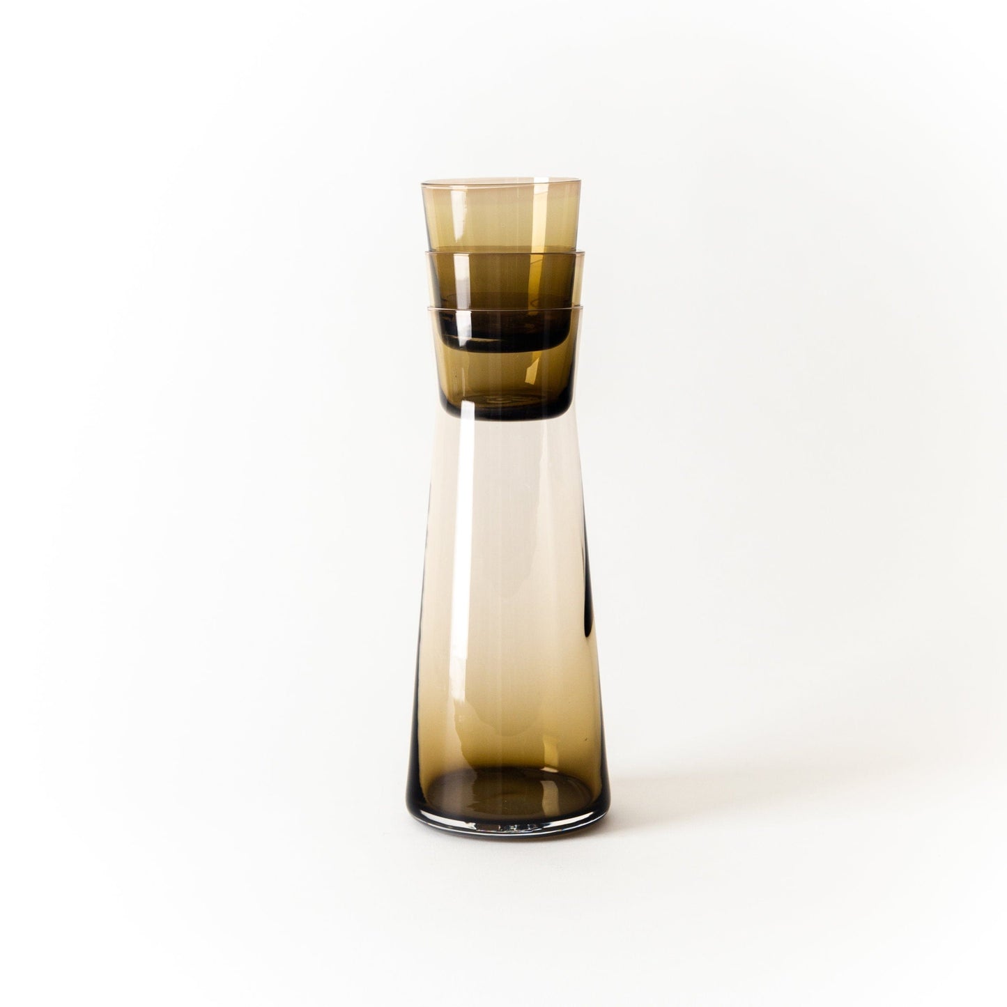 Large Wheat Colored glass carafe with two small cups nested inside the top