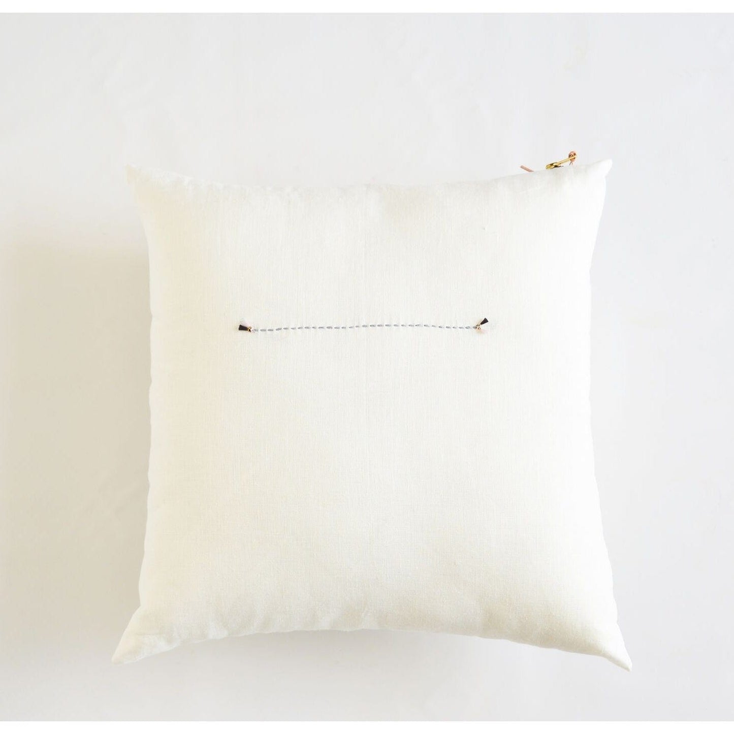 White Linen Pillow with Brass Zipper and Light Grey Stitching