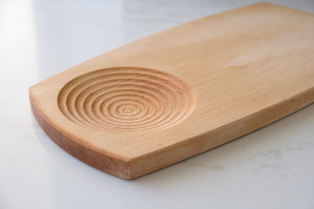 olive oil bowl carved into the dipping board