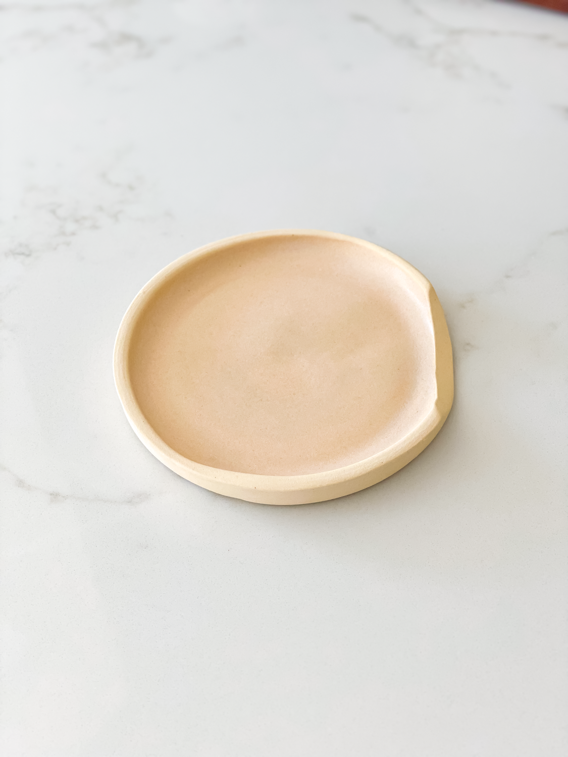 ceramic spoon rest on marble counter
