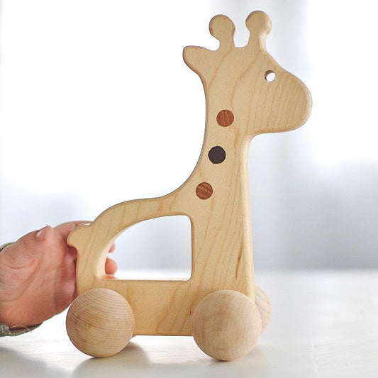 side view of wooden giraffe toy