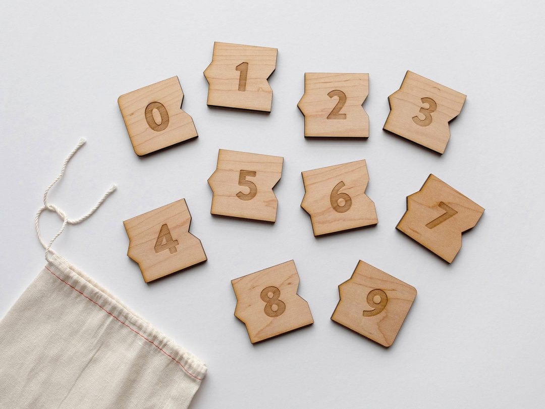 separated pieces of interlocking wooden number puzzle