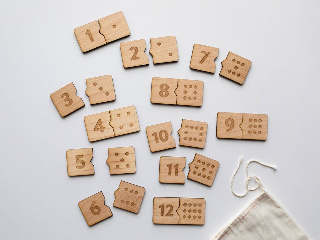 Wooden number domino puzzle with interlocking pieces