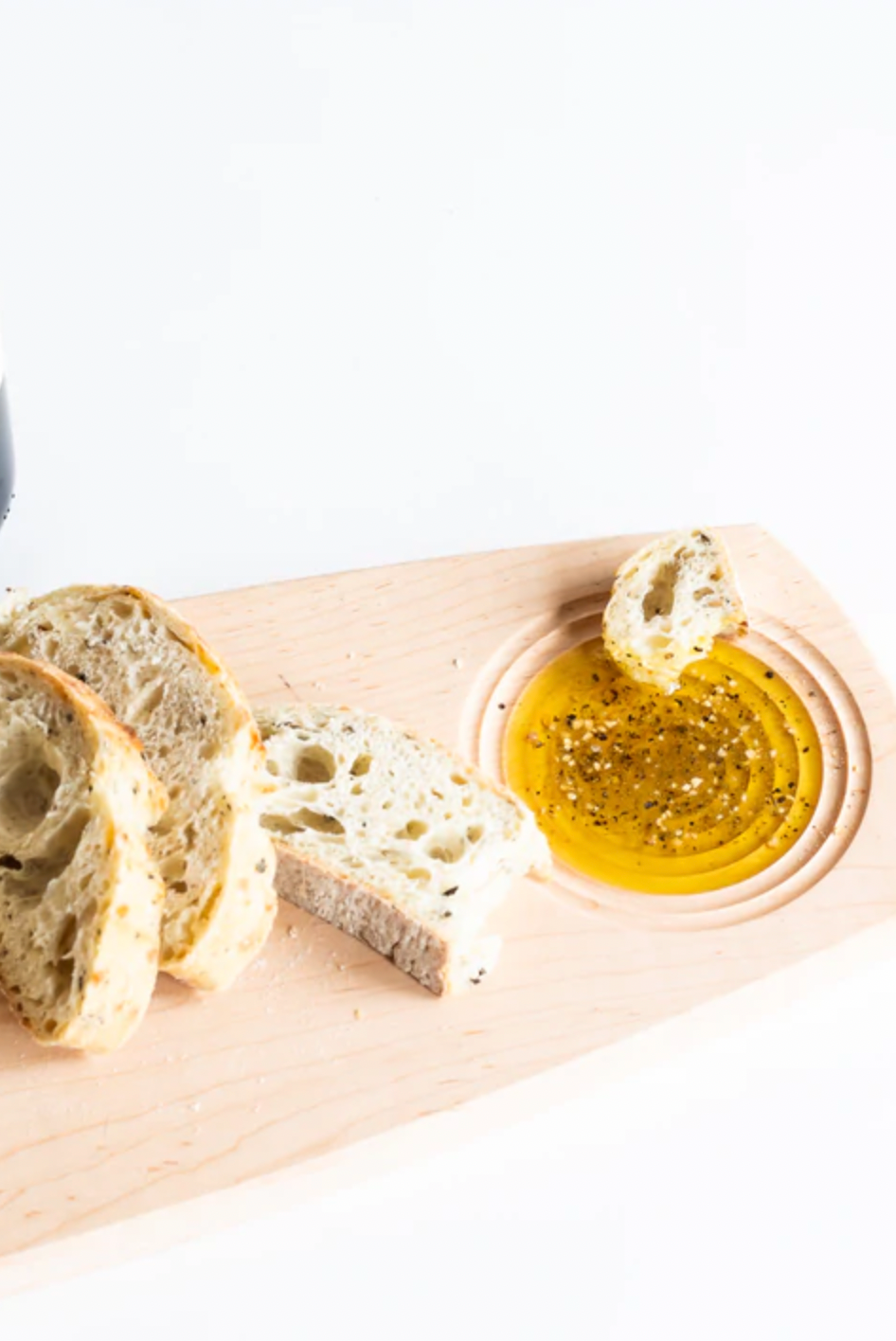 dipping board with olive oil and bread. 